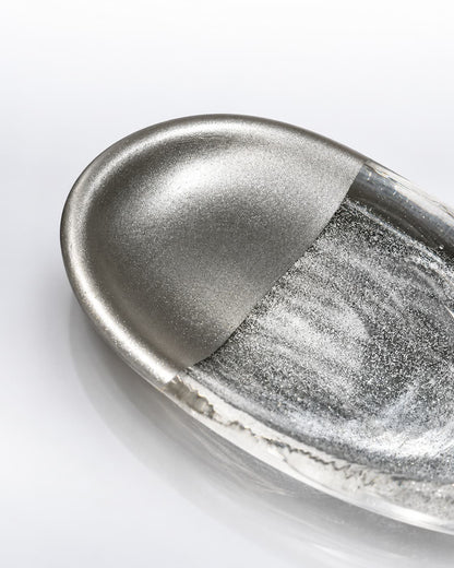 Close-up of the Silver Rift glass incense holder showing crystal texture, half-silver finish, and metal incense support.
