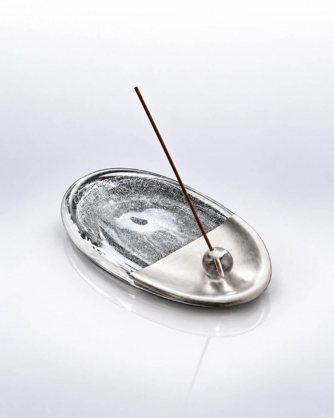 Silver Rift crystal glass incense holder with clear and half-silver finish, holding an unlit incense stick.