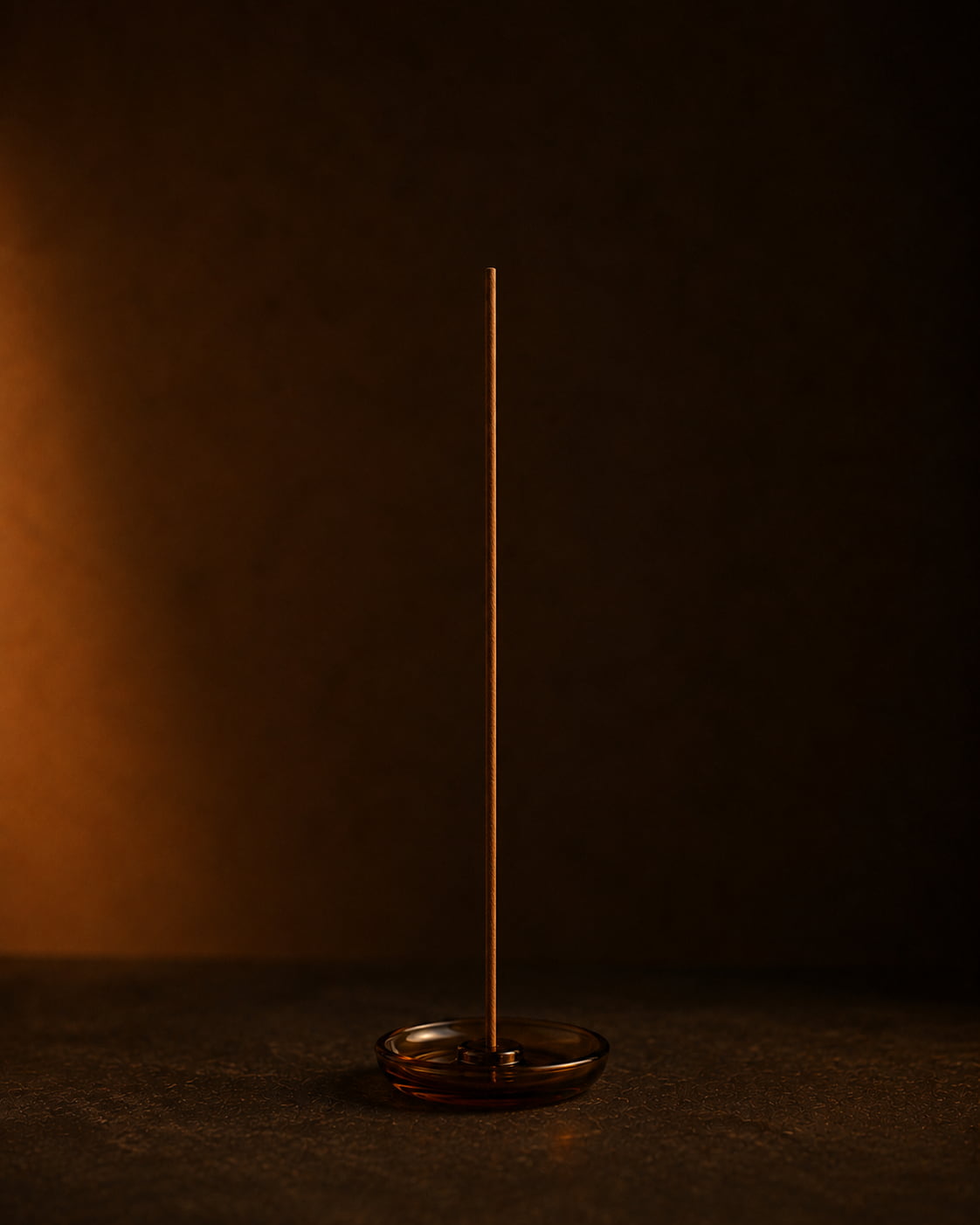 Unlit agarwood incense stick placed securely in a minimal incense holder