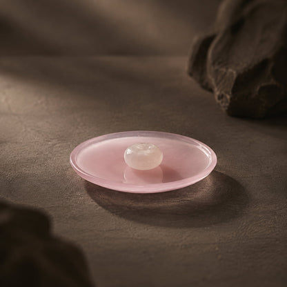 Top view of pink porcelain incense holder with jade center
