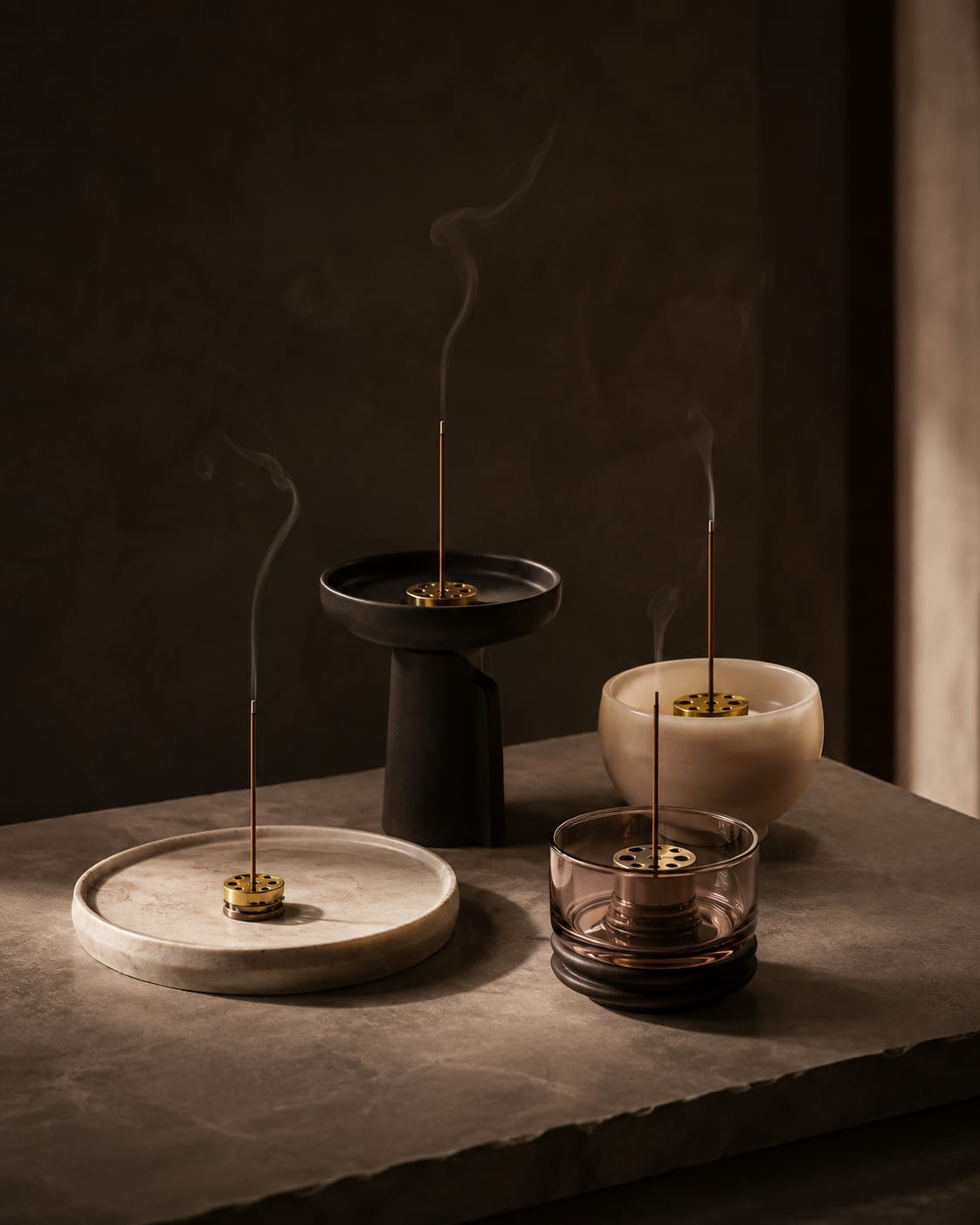 Sculptural incense holders with burning stick incense from the Silent Vessels collection